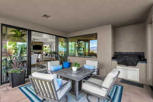 View of patio / terrace featuring outdoor dining area and grilling area
