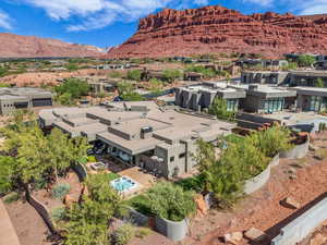 Aerial perspective of suburban area featuring a mountain backdrop