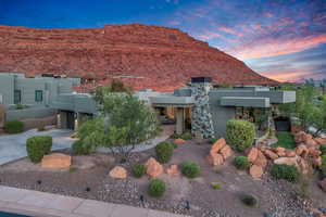 View of front of property featuring stucco siding and a mountain view