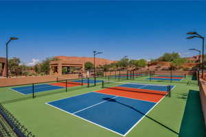 View of tennis court with community basketball court