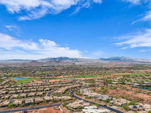 Aerial perspective of suburban area with a water and mountain view