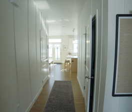 Hall featuring light wood-type flooring