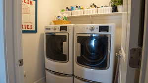 Washroom featuring independent washer and dryer