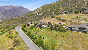 Aerial perspective of suburban area featuring a mountain backdrop