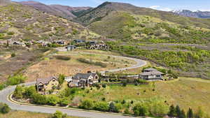 Aerial view of residential area featuring mountains