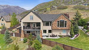 Back of property with a patio area, stucco siding, and a fenced backyard