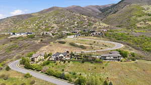 Aerial view of residential area featuring a mountainous background
