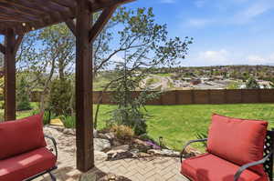 Fenced backyard with a patio