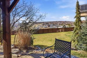 Fenced backyard featuring a residential view and a patio