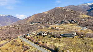 Aerial overview of property's location featuring a mountainous background