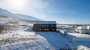 Rear view of house featuring a mountain view