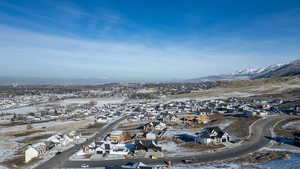 Snowy aerial view featuring a residential view