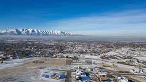 Snowy aerial view featuring a mountain view