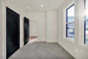 Unfurnished bedroom featuring carpet floors and recessed lighting