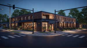 View of front of home featuring brick siding and a balcony