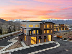 View of front of home featuring a mountain view and brick siding