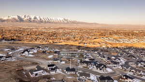 Aerial view of residential area featuring a mountainous background