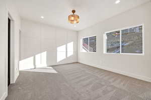 Unfurnished bedroom with carpet floors and recessed lighting