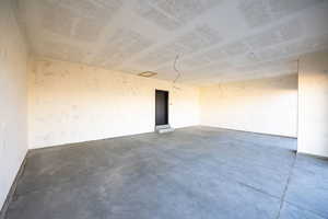 Spare room with concrete floors