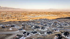 Aerial view of residential area featuring a mountain backdrop