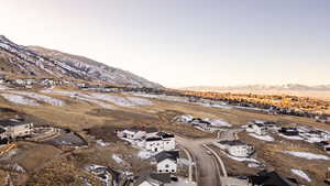 View of mountain backdrop featuring nearby suburban area