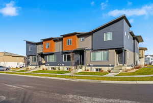 Modern home featuring a residential view and entry steps