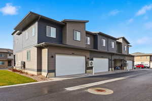 View of front of home featuring a residential view and an attached garage