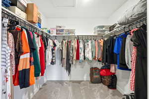 Spacious closet featuring carpet