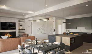Dining room featuring light wood-style floors, a warm lit fireplace, and recessed lighting