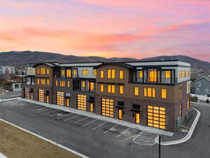Rear view of house with a mountain view and brick siding
