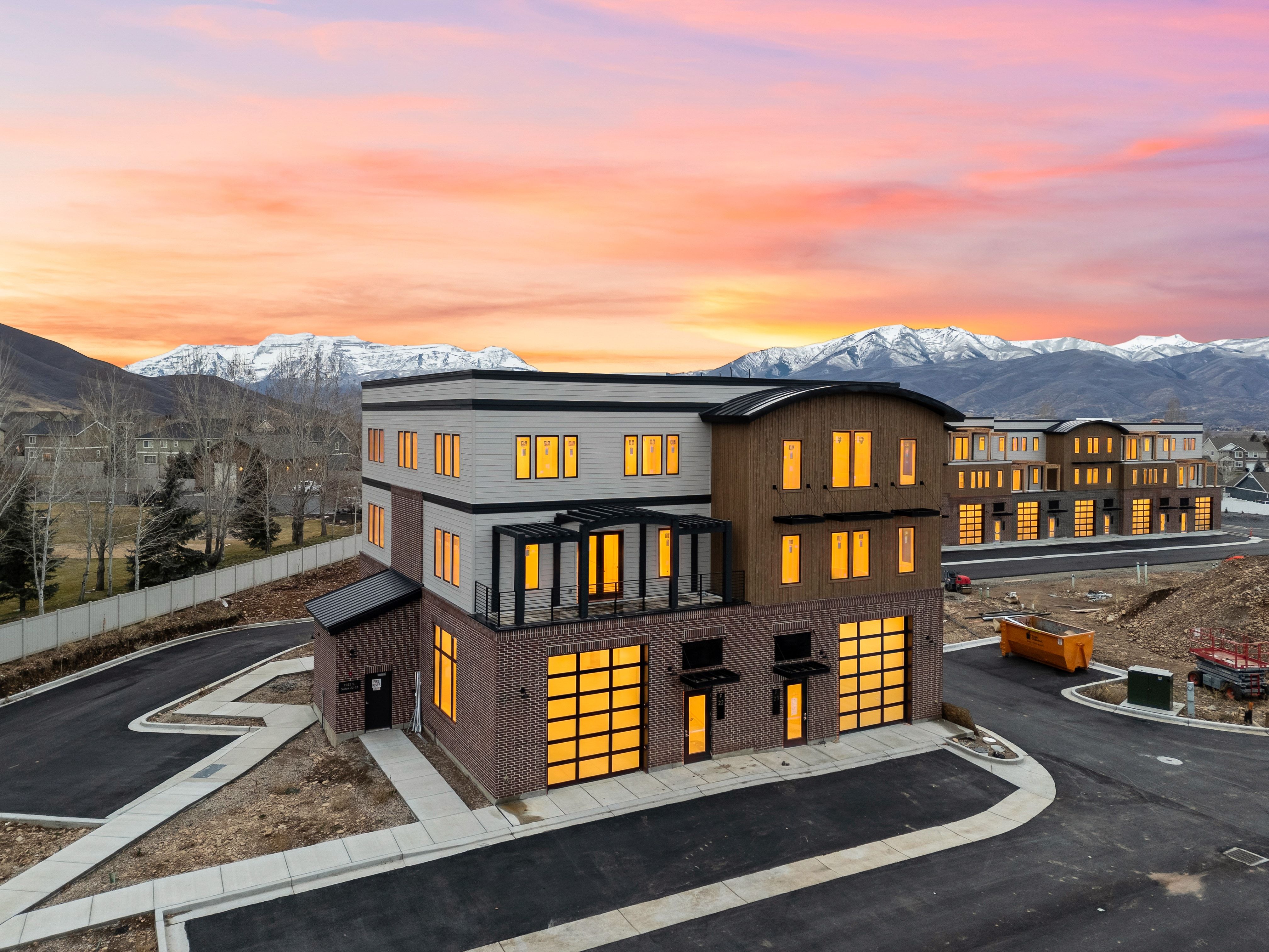 View of front of home featuring a mountain view and brick siding