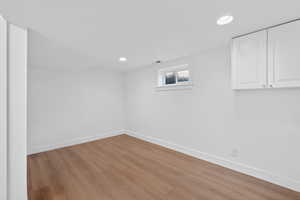 Basement featuring wood finished floors and recessed lighting