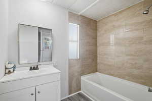 Bathroom with vanity and  shower combination