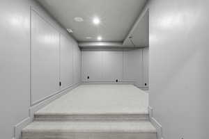 Staircase featuring recessed lighting