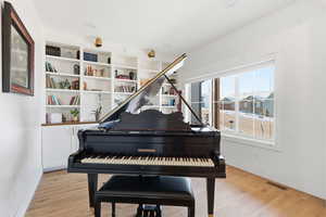 Sitting room with light wood-type flooring