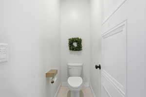 Bathroom featuring tile patterned flooring and baseboards