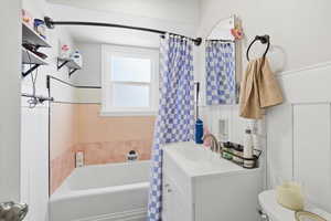 Upstairs Full bathroom featuring vanity, tile walls, and shower / bath combo