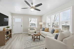 Upstairs Living area with light wood-type flooring and ceiling fan