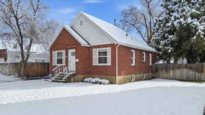 View of front of home featuring brick siding