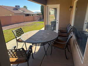 Fenced backyard featuring a patio and outdoor dining space