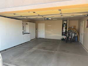 Garage featuring gas water heater