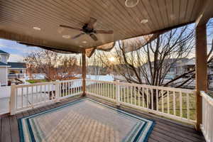 Wooden deck featuring a ceiling fan