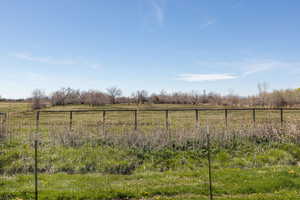 View of yard with a rural view