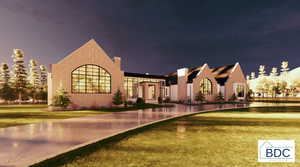 View of front of house with a front lawn and stucco siding