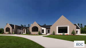 View of front facade with a front yard and driveway