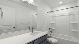 Bathroom with tub / shower combination, vanity, and recessed lighting