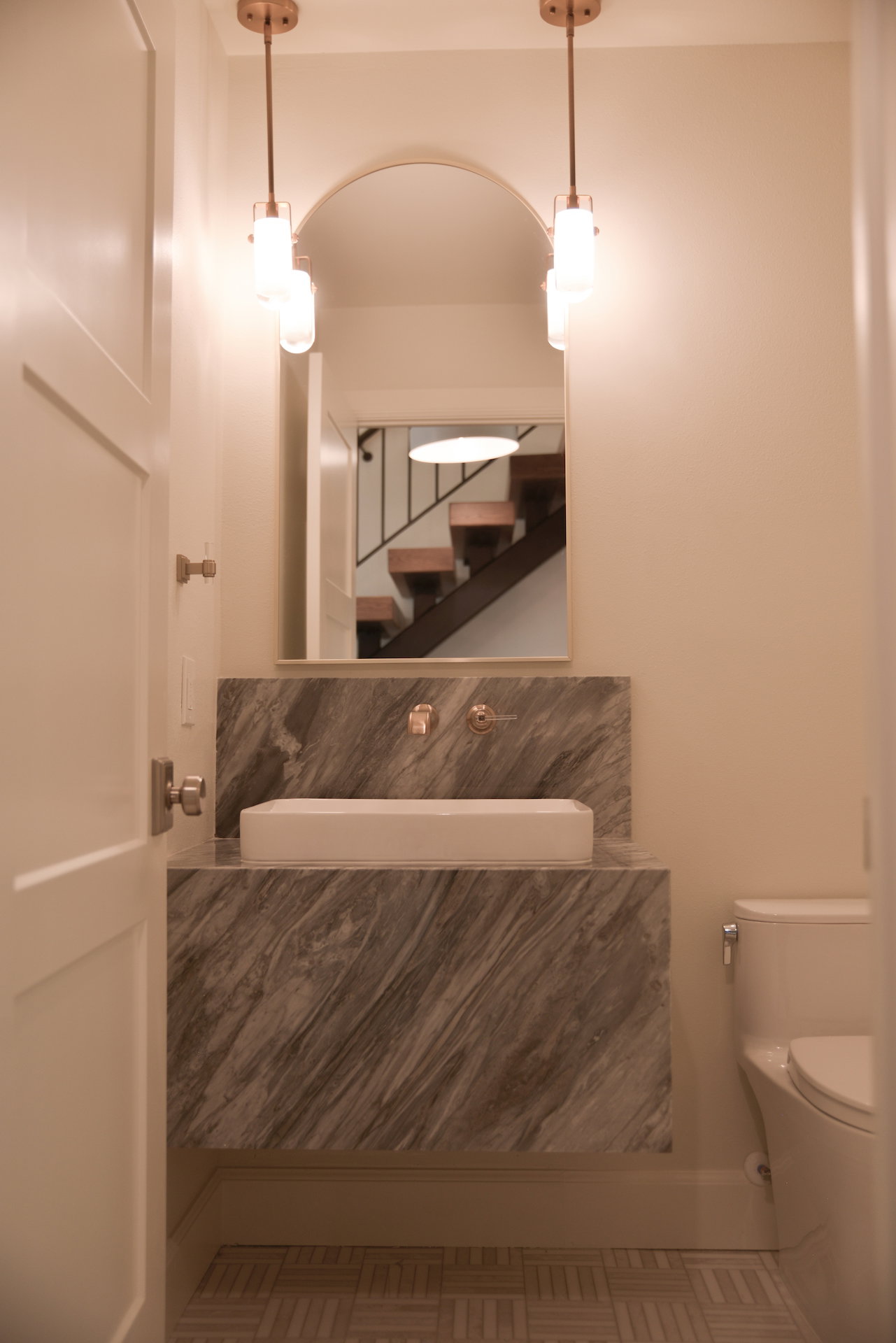 Half bath featuring vanity and toilet