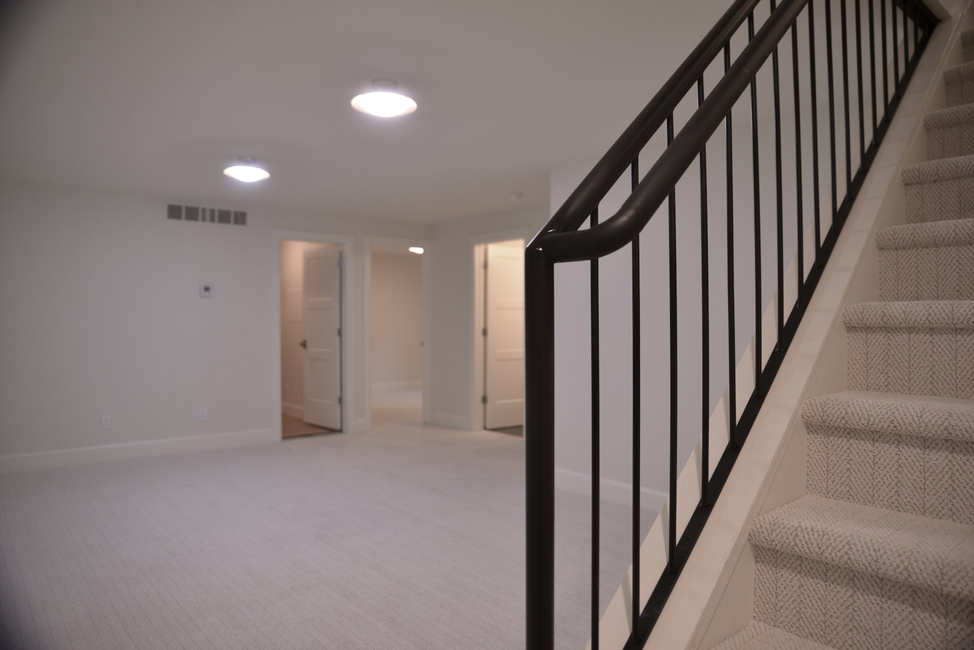 Stairs featuring carpet floors and baseboards