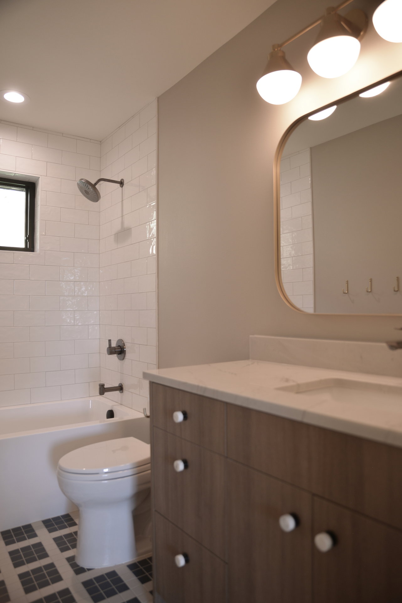 Bathroom with vanity, shower / tub combination, tile patterned flooring, and recessed lighting