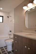 Bathroom with vanity, shower / tub combination, tile patterned flooring, and recessed lighting